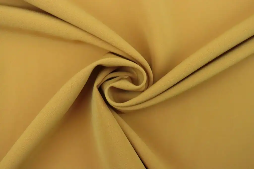 Yellow cupro fabric that is smooth shiney and looks soft to the touch