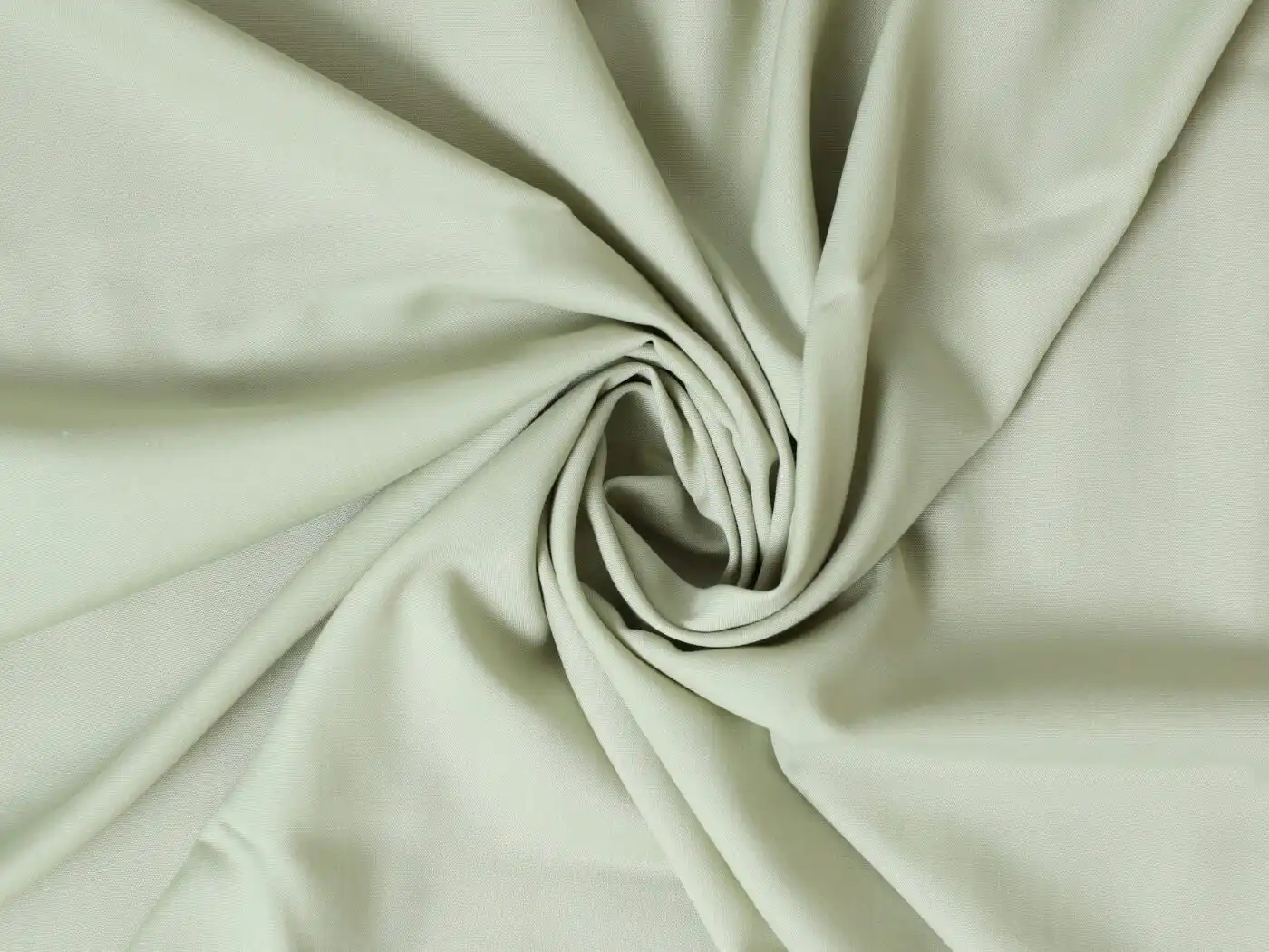 image of a light green smooth fabric that looks soft in touch 