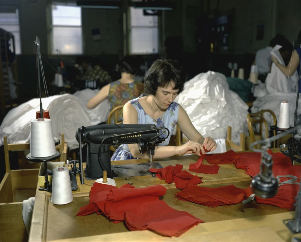 woman sewing together a bathing suit