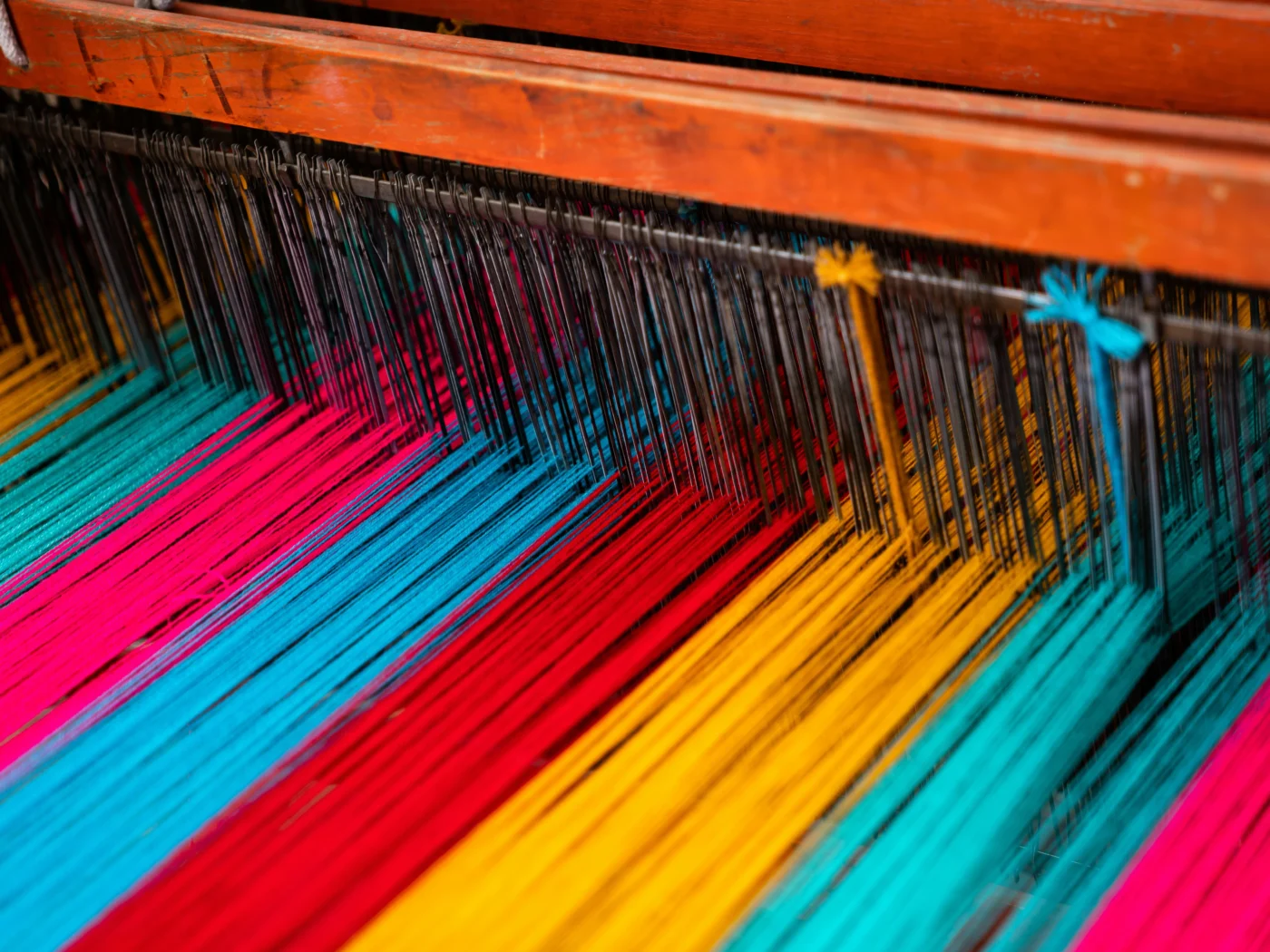 Weaving fibers on a loom.