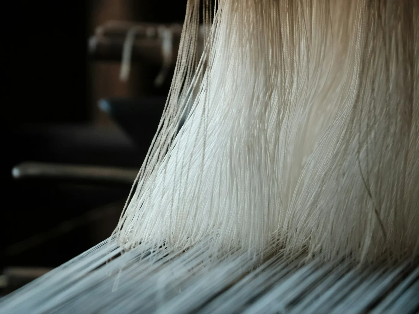 Weaving fibers into fabric