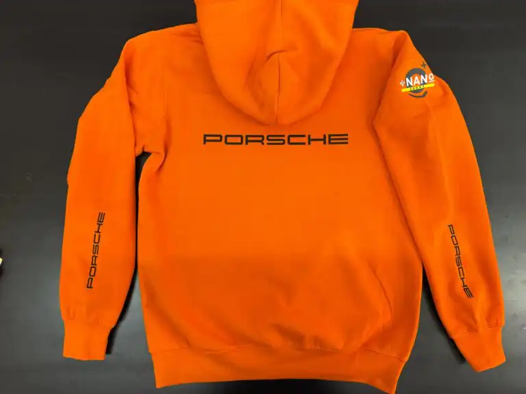 Iron Lynx orange hoodie with Porsche lettering made in Italy