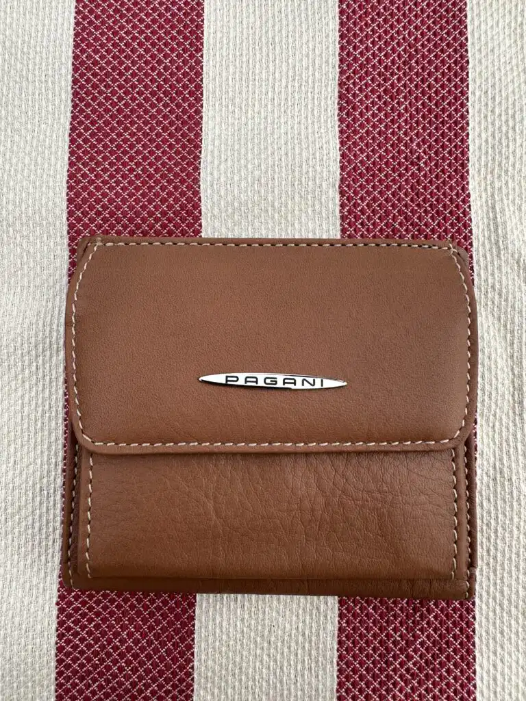 Pagani branded leather wallet on striped fabric, made in Italy