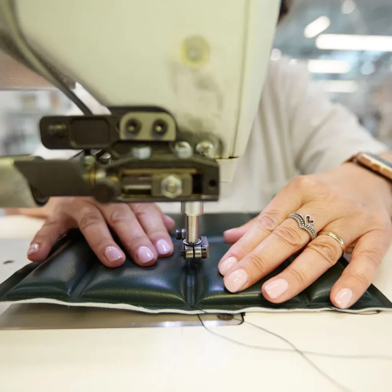Artisan sewing in an Italian workshop