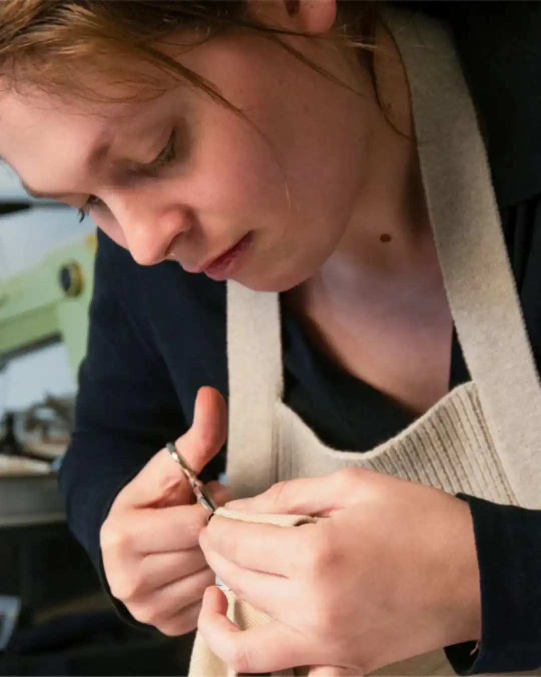 Finishing a garment at the sewing machine