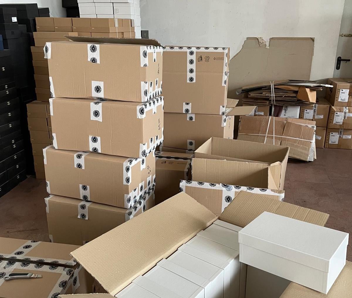 Finished garments packed in boxes, ready to ship, the stage to ask a manufacturer about shipping and duties.