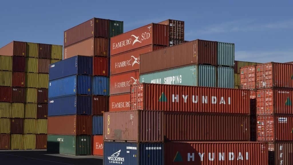 Shipping containers at port, where an entire clothing production can sit in a single load.
