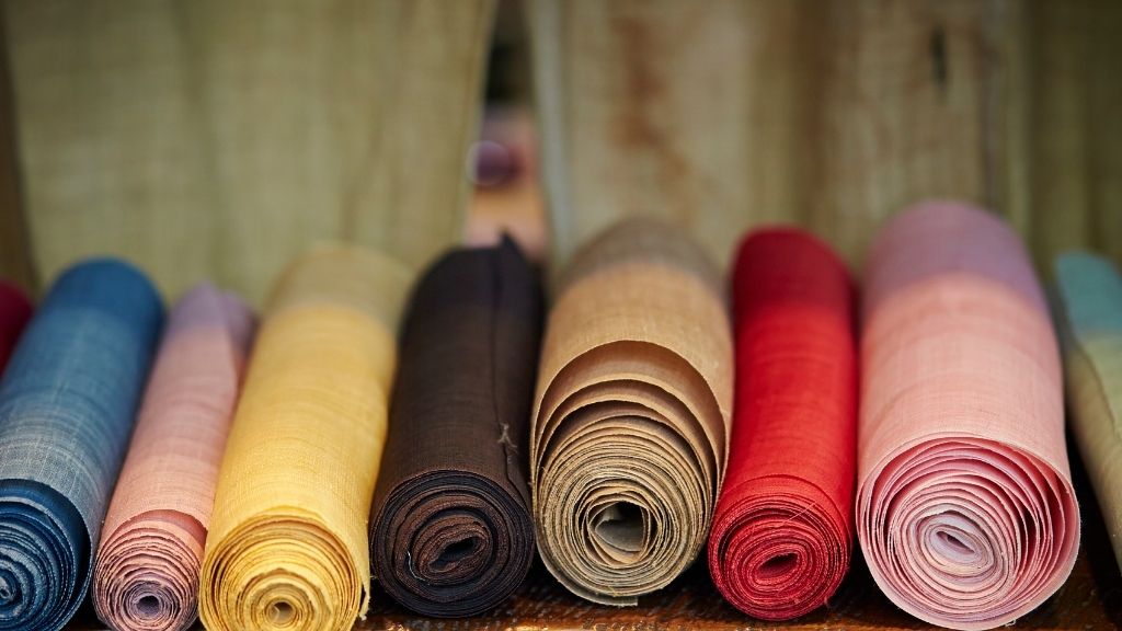 A range of different textiles, showing why fabric weight, weave, and finish must be specified precisely.
