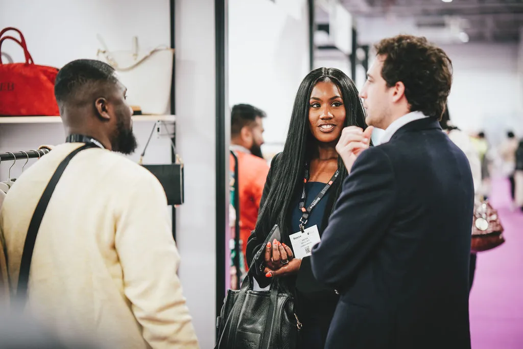 A brand founder asking a clothing manufacturer questions before starting production.