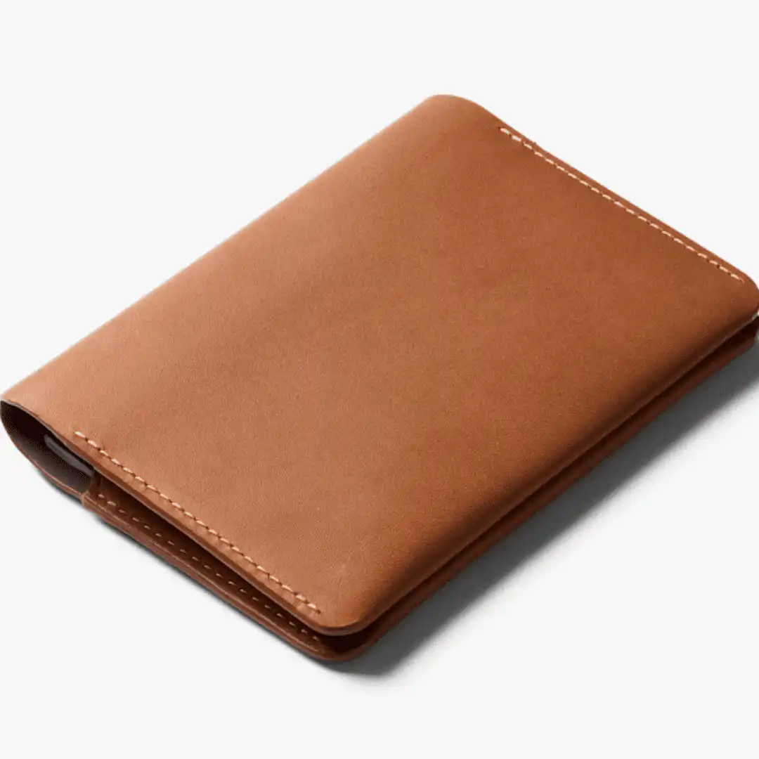 Tan leather passport holder with contrast stitching, made in Italy
