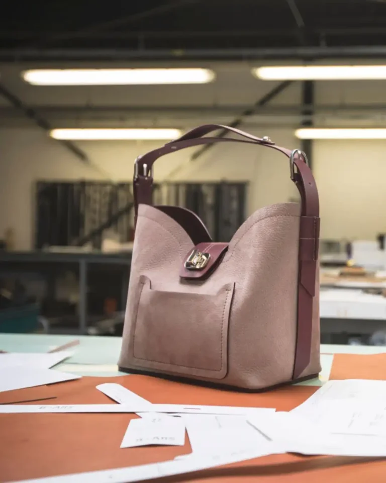 Handbag manufacturer in Italy: a leather bag on the workbench of an Italian workshop